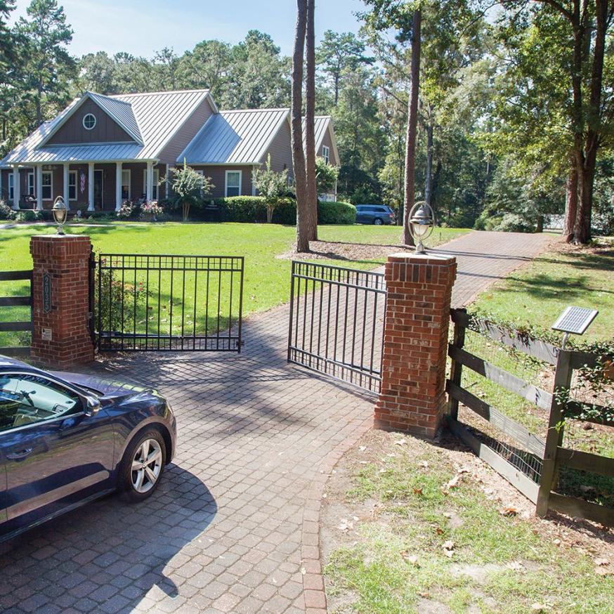 A car entering a swing gate